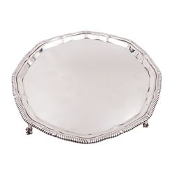 Early 20th century silver waiter, of hexagonal form, with oblique gadrooned rim, upon four ball and claw feet, hallmarked Goldsmiths & Silversmiths Co Ltd, London 1919, D21cm