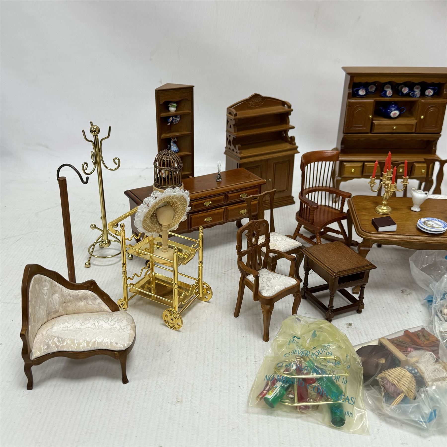 1:12 scale dolls house hallway and dining room furniture, including hat stand, mannequin, dressers and cabinets with ceramic ornaments, rocking chair, dining table, side board, dresser, drinks trolley, sewing machine, dining accessories and food, etc