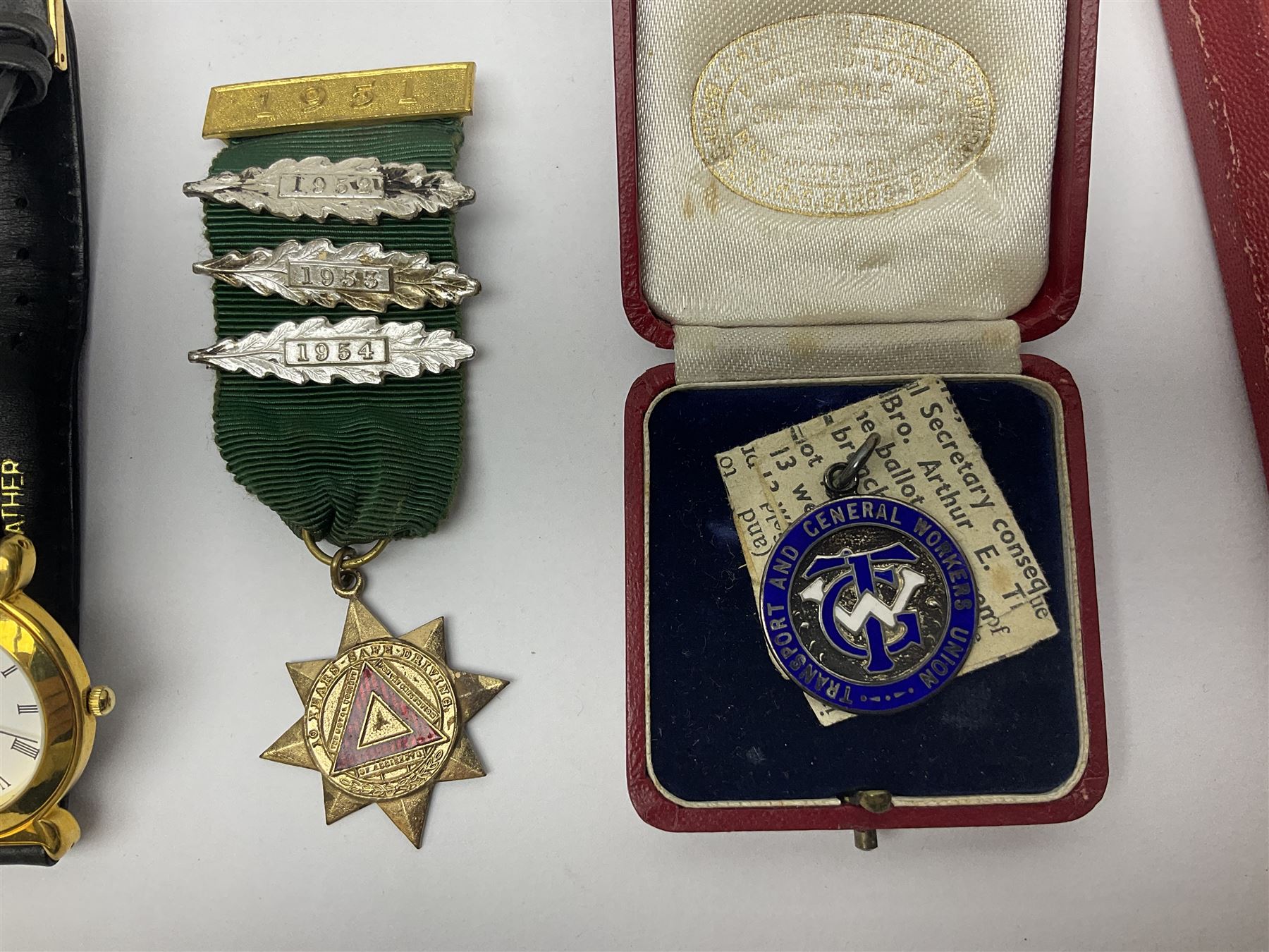 Ladies Accurist 9ct gold manual wind wristwatch, on gilt metal bracelet, together with a silver and enamel fob, for the Transport and General Workers Union, with personal engraving to reverse, hallmarked, a safe driving medal and a Quartz wristwatch