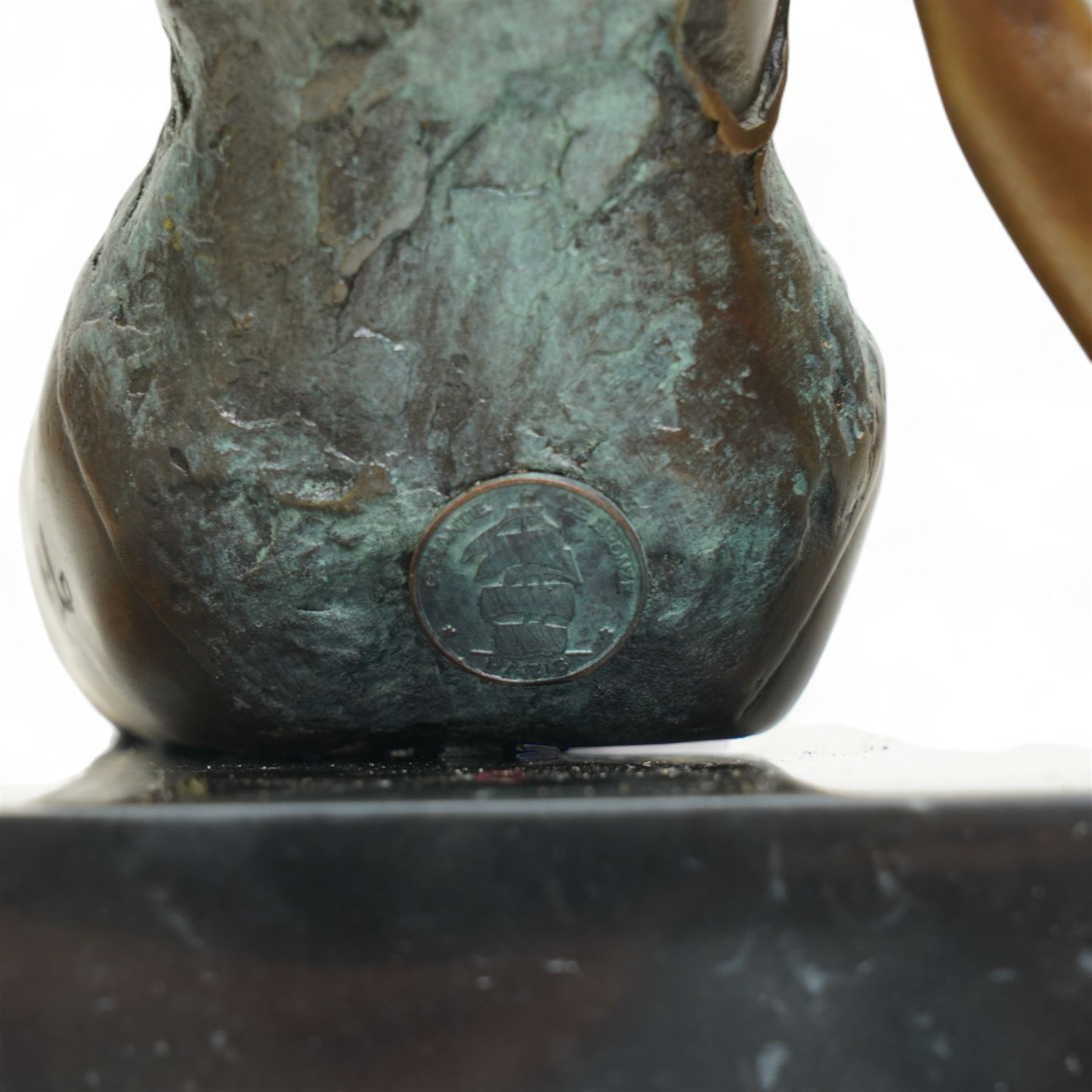 Bronze modelled as a seated lady, signed Milo, on black hardstone base, H25cm 