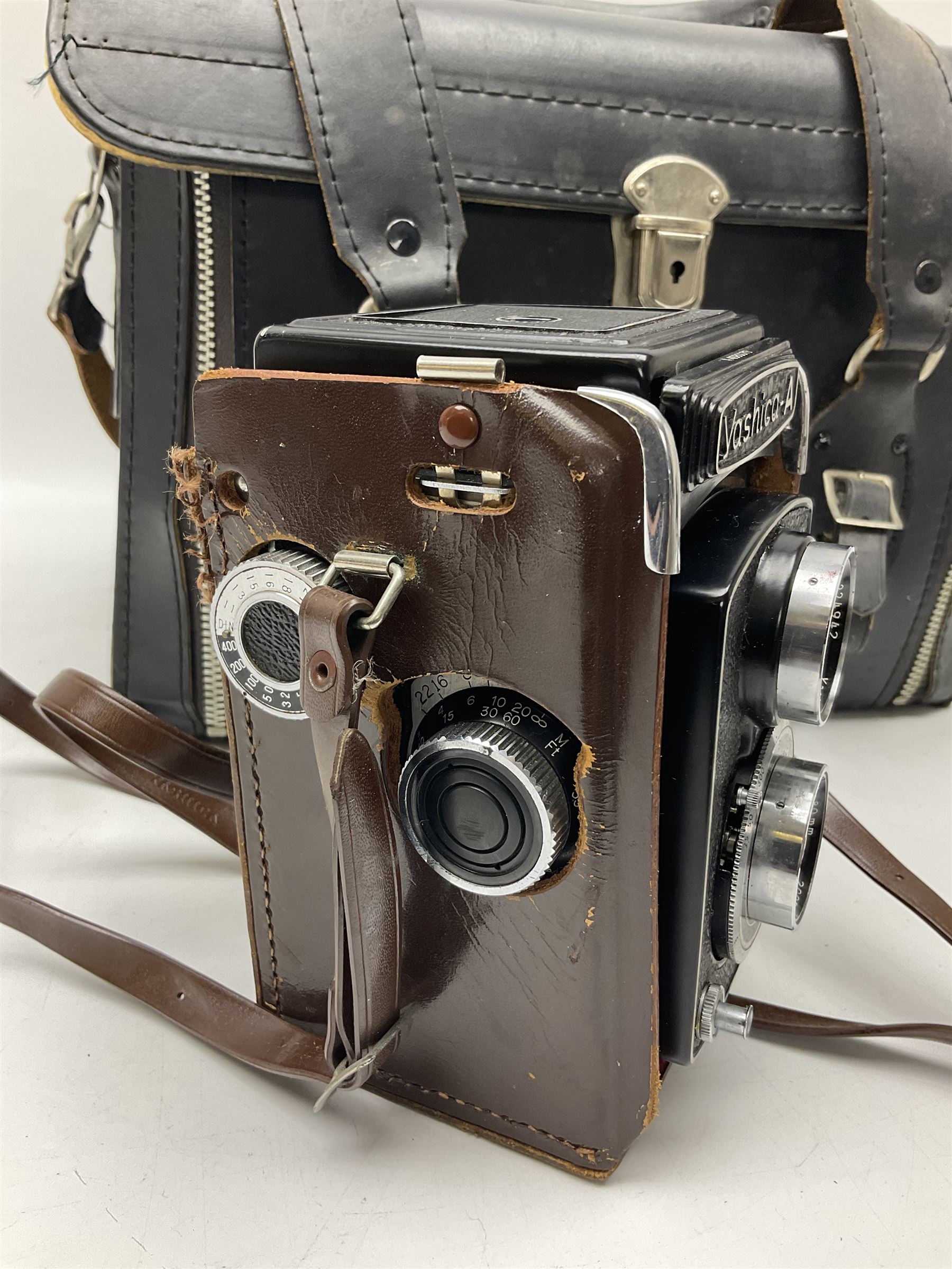 Yashica-A camera body, serial no. A4080073, with 'Yashikor 1:3.5 f=80mm' lens, serial no. 209272 and 'Yashikor 1:3.5f=80mm' lens, serial no 22942, together with Yashica TL-Electro camera body, serial no. 5054162 with 'Yashinon-DS 50mm 1:1.9  40056038