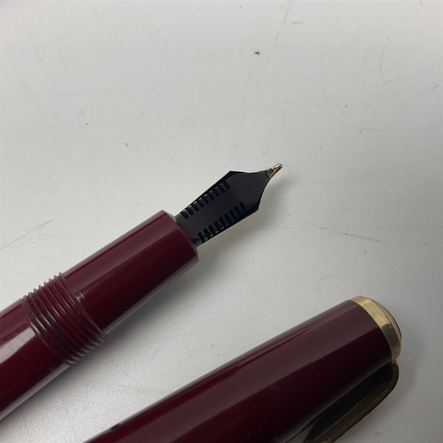 Four fountain pens, each with 14ct gold nibs, comprising Mentmore Paramount, Parker Junior Duofold, Conway Stewart marbleised pen and Waterman's, together with a 14ct gold Conway Stewart 5B nib