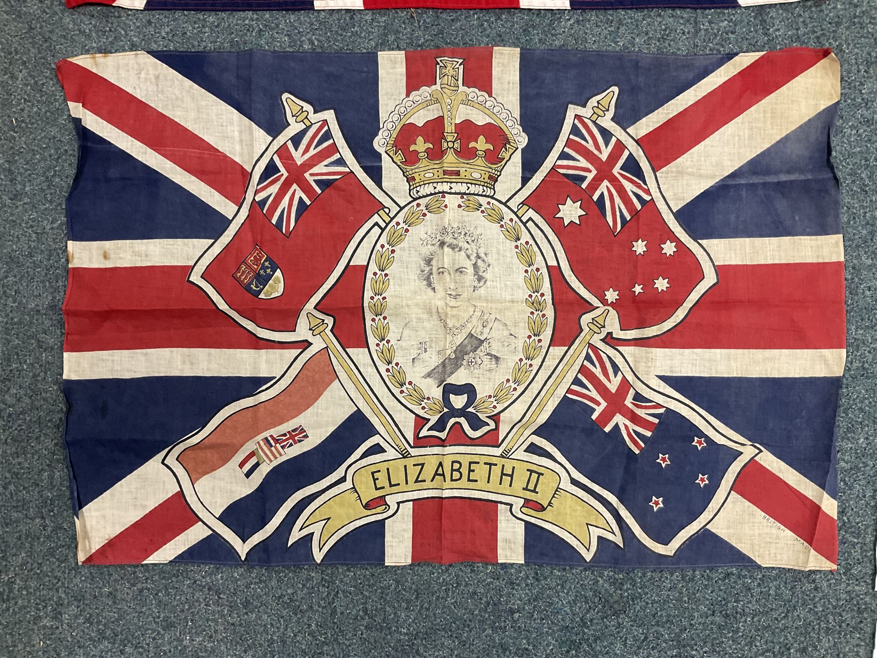 Six flags - White Ensign 180 x 86cm; two Union flags 180 x 86cm and 132 x 62cm; Falklands Islands 153 x 89cm; Yorkshire Rose 153 x 89cm; and QEII 1953 Coronation 84 x 57cm (6)