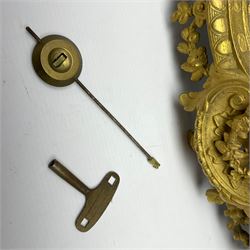 French - late 19th century 8-day gilt spelter mantle clock retailed by J Vassalli of Scarborough c1890, sculptured with an oriental 16th century representation a Mughal warrior slaying a leopard, raised on a profusely  decorated base with scroll work and splayed feet, white enamel dial with Roman numerals, minute track and steel hands, Parisian twin train countwheel striking movement, striking the hours and half-hours on a bell. With pendulum & Key.  