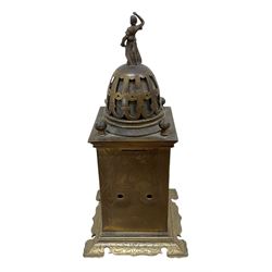 Tiffany- early 20th century brass cased 8-day mantle clock, rectangular case with engraved images taken from classical & mythological fables, with an open strapwork dome, finials to the corners and a cast figure of a standing maiden, case raised on a splayed base with acanthus engraving, enamel dial with Roman numerals, minute markers and steel hands, dial centre engraved Tiffany & Co Paris, twin train French movement with a platform escapement wound from the rear, baseplate of case stamped with the serial numbers 4372 & 5652. With key. 
Provenance from Chatsworth House, Derbyshire.