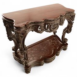 Chinese stained hardwood side table, late Qing dynasty style, with shaped top above a pierced and carved frieze of foliage and fruiting vines, cabriole legs terminating in scroll feet, united by a carved shaped undertier