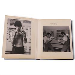 1980s boxing autograph book and photograph album, the album containing a collection of black and white photographs, mostly of British lightweight champion George Feeney, the photograph album with thirty-two signatures including Ray 