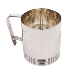 Mid 20th century silver christening mug, of plain cylindrical form, with reeded decoration to handle and base and monogrammed initials to body, hallmarked Atkin Brothers, Sheffield 1940