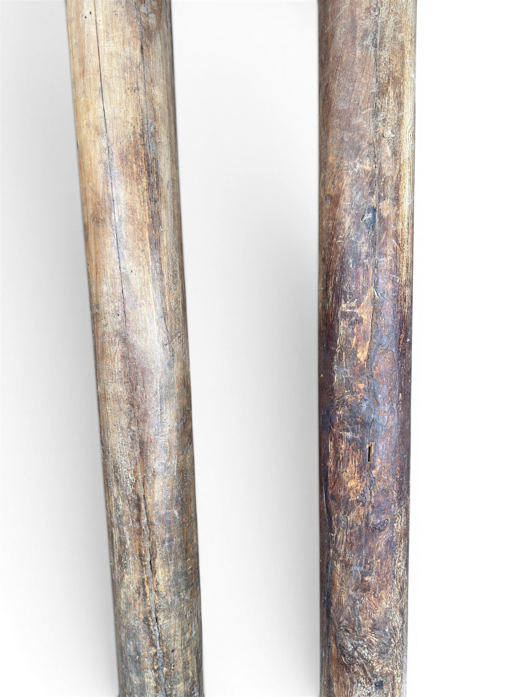 Matched pair of 19th century hardwood architectural columns with carved capitols, column diameter 18cm