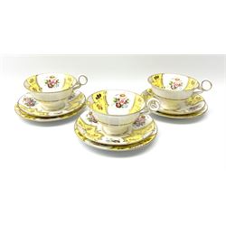 A set of three Fenton teacups, saucers and plates, decorated with floral sprays and yellow panels, heightened throughout in gilt, with printed marks beneath and pattern no 4567.