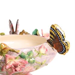 Delphin Messier (1836-1907), glazed earthenware cache-pot, decorated with three butterflies surrounded by floral and foliate motifs. upon a pink circular foot, signed beneath, H24cm