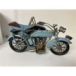 Two carriage clocks; boxed La Pieta figurine; and boxed metal model of a combination motorcycle (4)