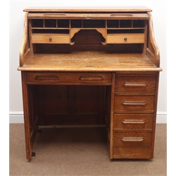  Early 20th century oak single pedestal tambour roll top desk, enclosing fitted interior, one long and three short drawers, W108cm, H118cm, D70cm  