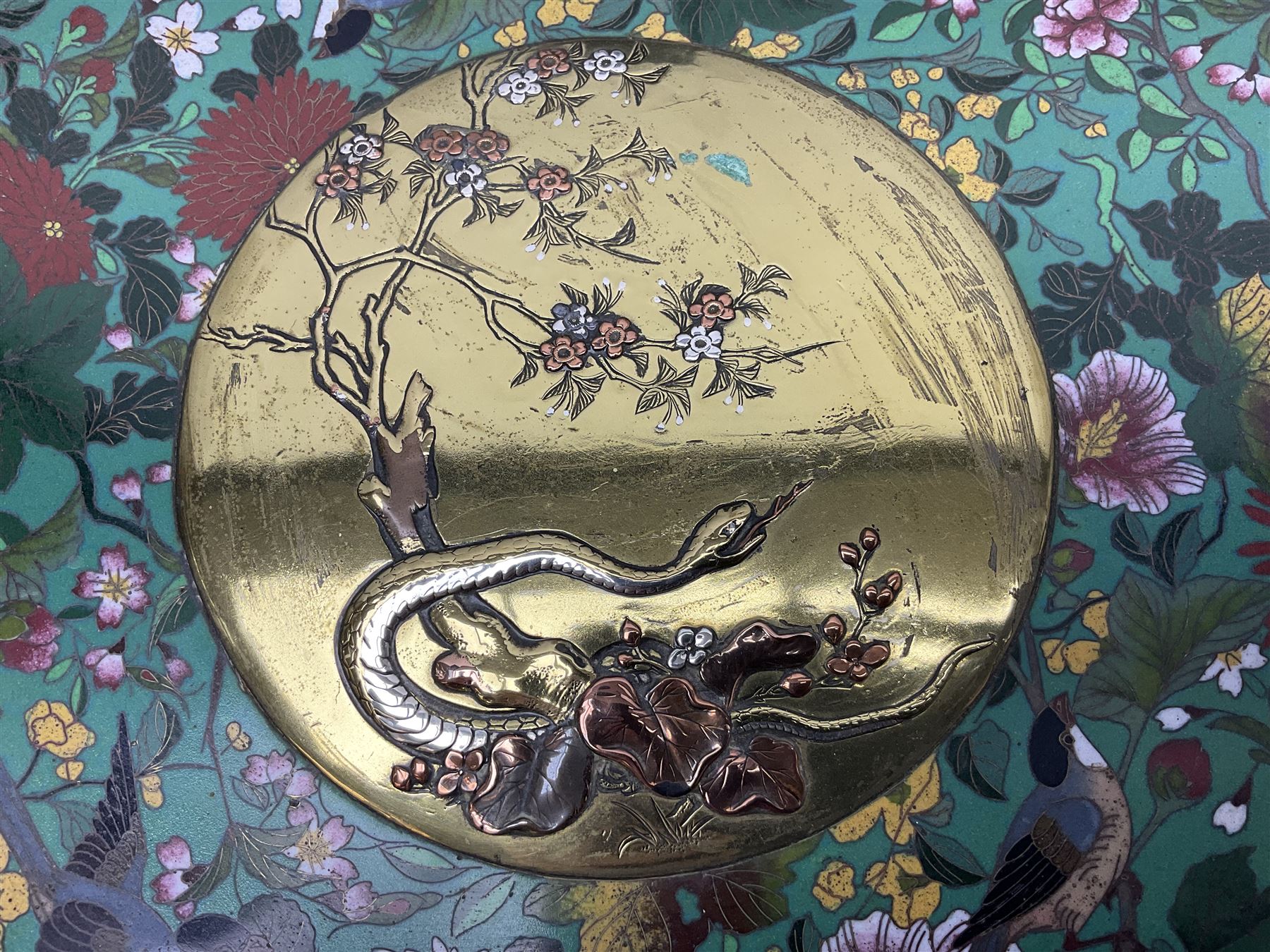 Cloisonné plate decorated with birds and flowers, together with a pair of Cloisonné vases of baluster form 