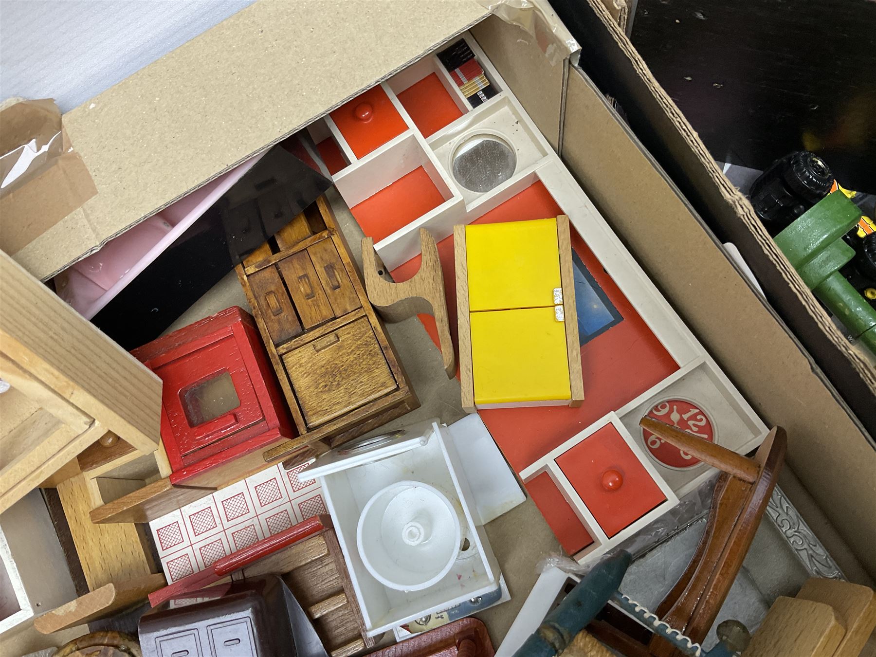 Large quantity of 1970s doll's house furniture, predominantly stained or painted wooden, including lounge, dining room, kitchen and bedroom pieces, bathroom fittings, bureaux and desks, piano, lamps, fire-surrounds etc; various scales