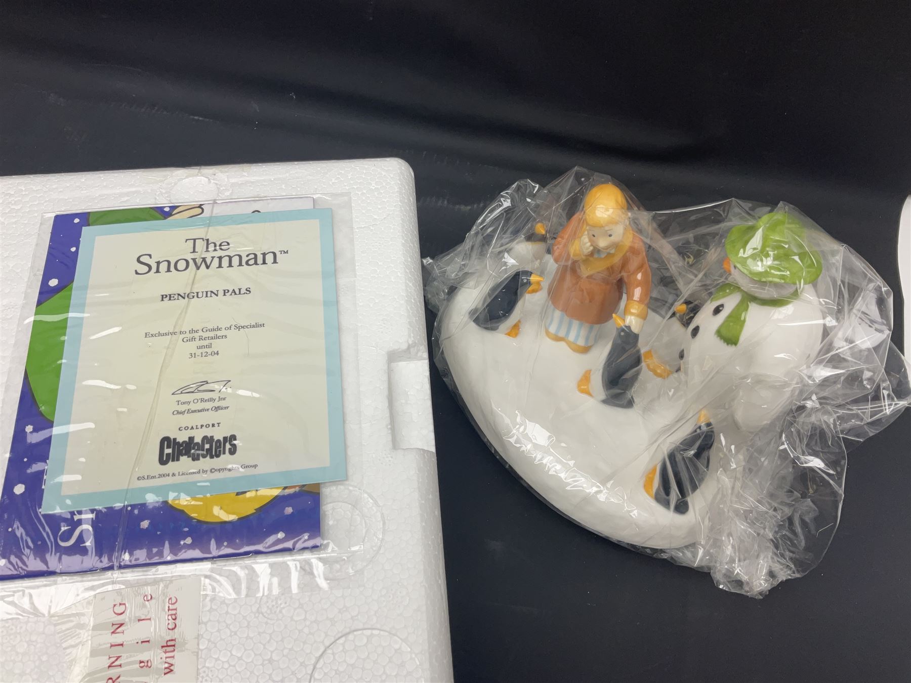Four Coalport Characters The Snowman figures, comprising Dancing the Night Away with certificate, Penguin Pals, with certificate, Dressing Up and Soft Landing, all with original boxes 