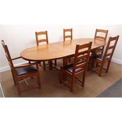  French solid oak oval extending dining table with two leaves, square supports joined by curved 'H' stretcher (W232cm, H78cm, D111cm) and set six (4+2) ladder back chairs, upholstered seat (W59cm)   