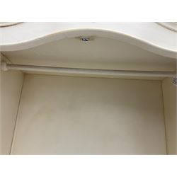 French design cream painted armoire wardrobe, shaped top with shell and flower head pediment, enclosed by two mirror glazed doors, the base fitted with single drawer