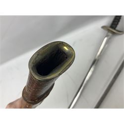 George V British Army 1897 pattern officers sword with plain 82cm fullered steel blade, pierced  basket hilt with George V cypher and wire bound leather grip with chequered backstrap; in leather covered field service scabbard L101cm overall; and another officer's sword in relic condition lacking scabbard (2)