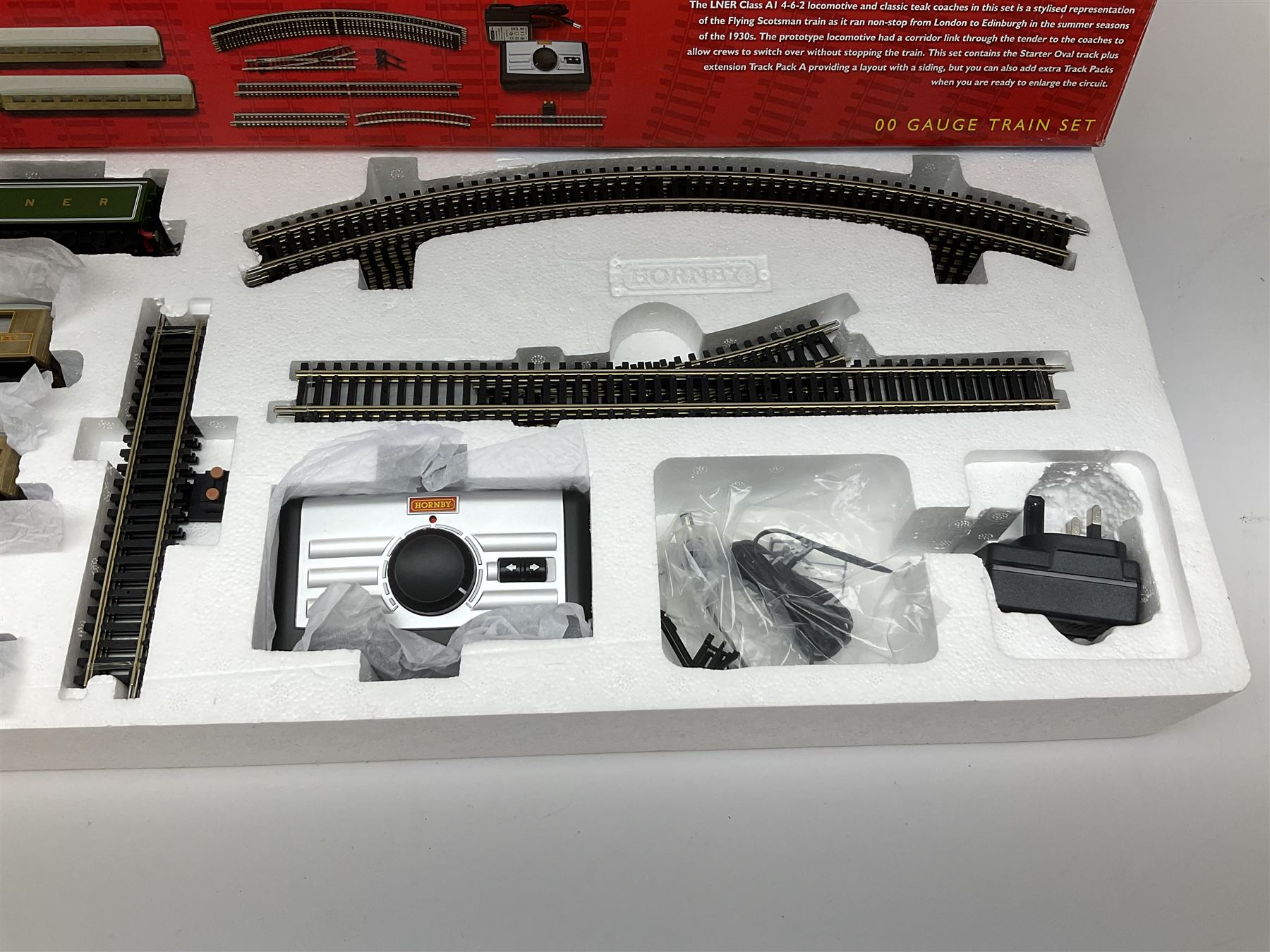 Hornby '00' gauge - Flying Scotsman electric train set with Class A3 4-6-2 locomotive 'Flying Scotsman' No.4472 and three teak style passenger coaches, boxed with TrakMat pack