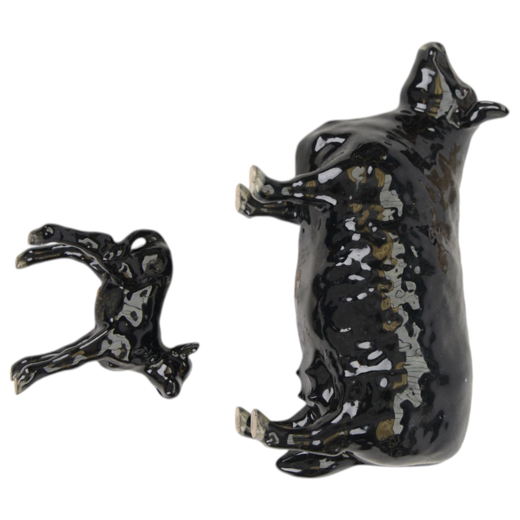 Four Beswick cattle figures, comprising Aberdeen Angus family; Bull, model 1562, Cow, model 1563 and Calf model 1249 and Charolais Cow model 3075