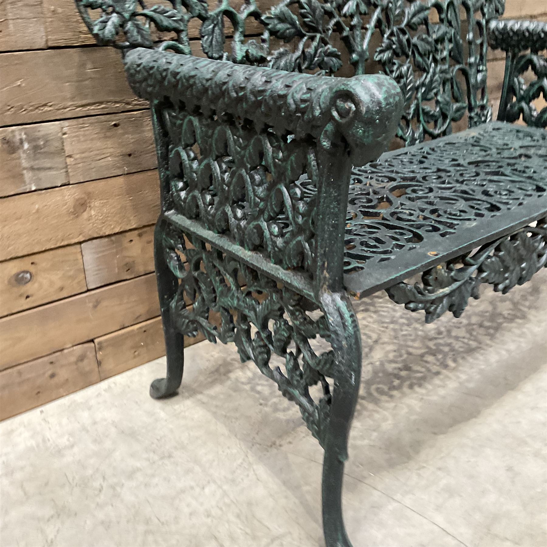 Victorian design heavy cast iron garden bench, ornate shaped back with rope twist and ramshead arms H88cm, W100cm