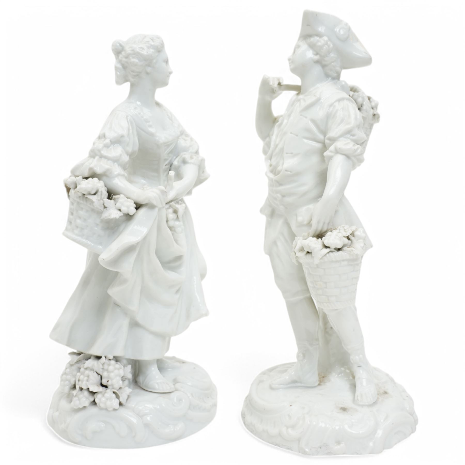 Pair of 19th century Berlin blanc de chine figures of flower sellers on circular bases H25cm and a figure group of mother and child (3)