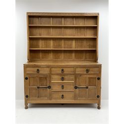 'Mouseman' adzed oak dresser, raised three heights plate rack, six drawers and two cupboards, carved with mouse signature, by Robert Thompson of Kilburn