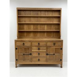 'Mouseman' adzed oak dresser, raised three heights plate rack, six drawers and two cupboards, carved with mouse signature, by Robert Thompson of Kilburn