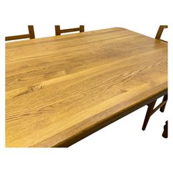 Contemporary light oak farmhouse dining table, and four oak ladder back dining chairs, rectangular top with rounded corners, raised on four turned baluster legs in natural lacquered finish, chairs with three horizontal slats beneath a shaped top rail, solid seat and square section legs united by stretchers