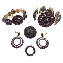 Victorian Bohemian garnet jewellery including two graduating oval cluster bracelets, pair of screw back pendant earrings and two brooches