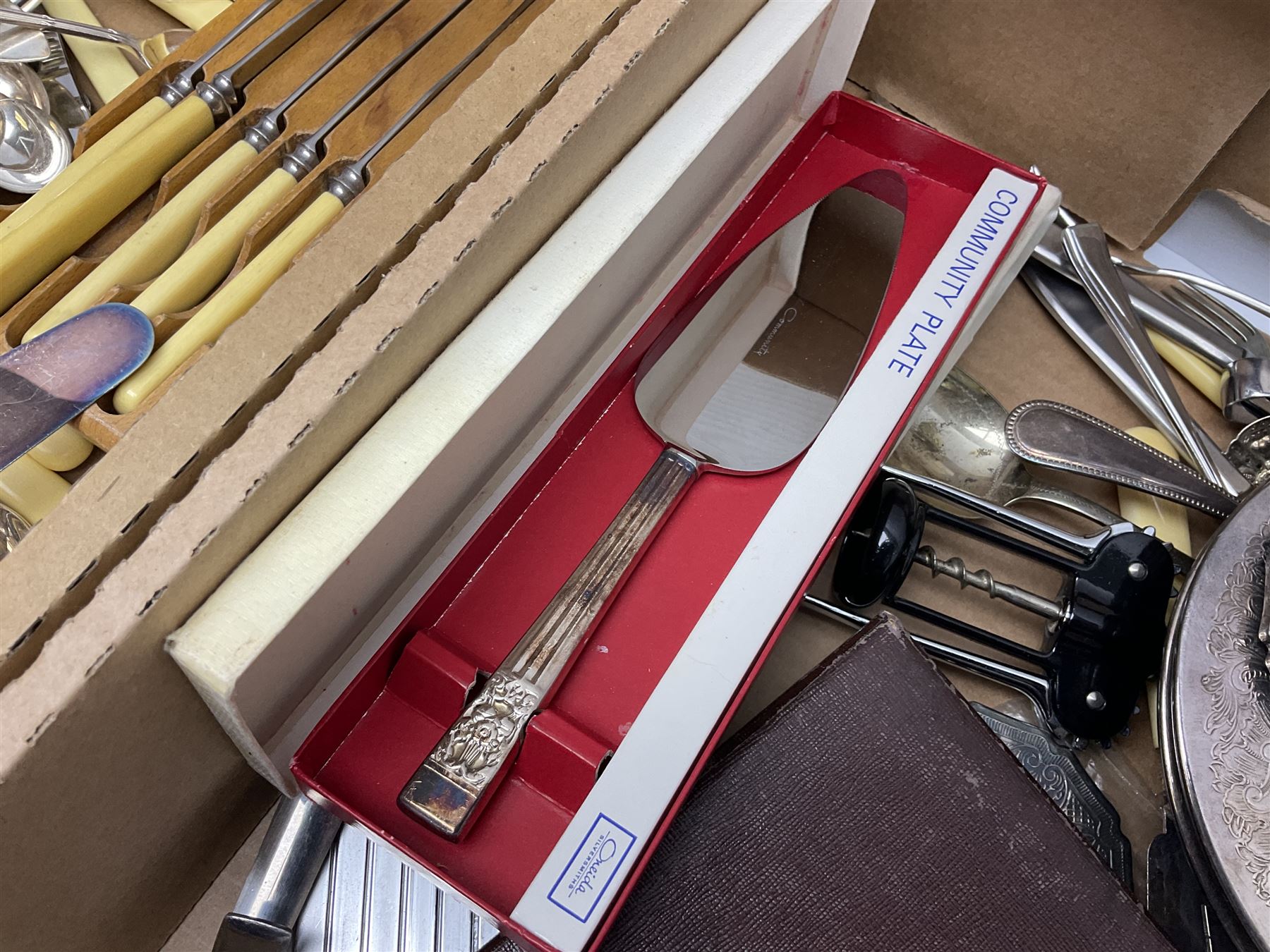Set of four hallmarked silver teaspoons modelled on spoons from the Roman Imperial period, silver fork, and quantity of silver plated and other cutlery to include Walker & Hall, in two boxes