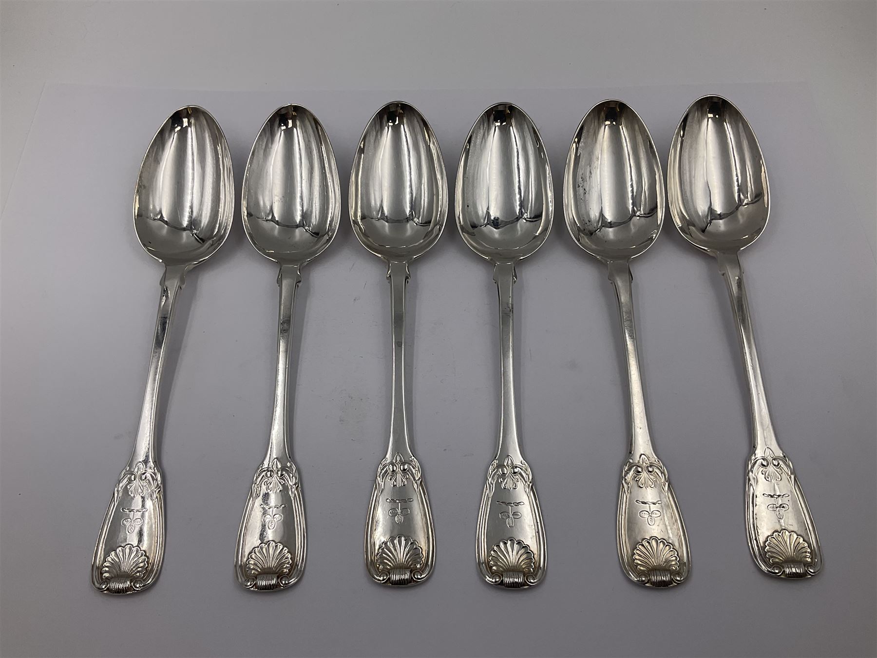 George IV Scottish silver Kings pattern cutlery for six place settings, to include table spoons, table forks, dessert spoons and dessert forks, all engraved with shamrock crest to terminal, hallmarked Robert Gray & Son, Glasgow 1833