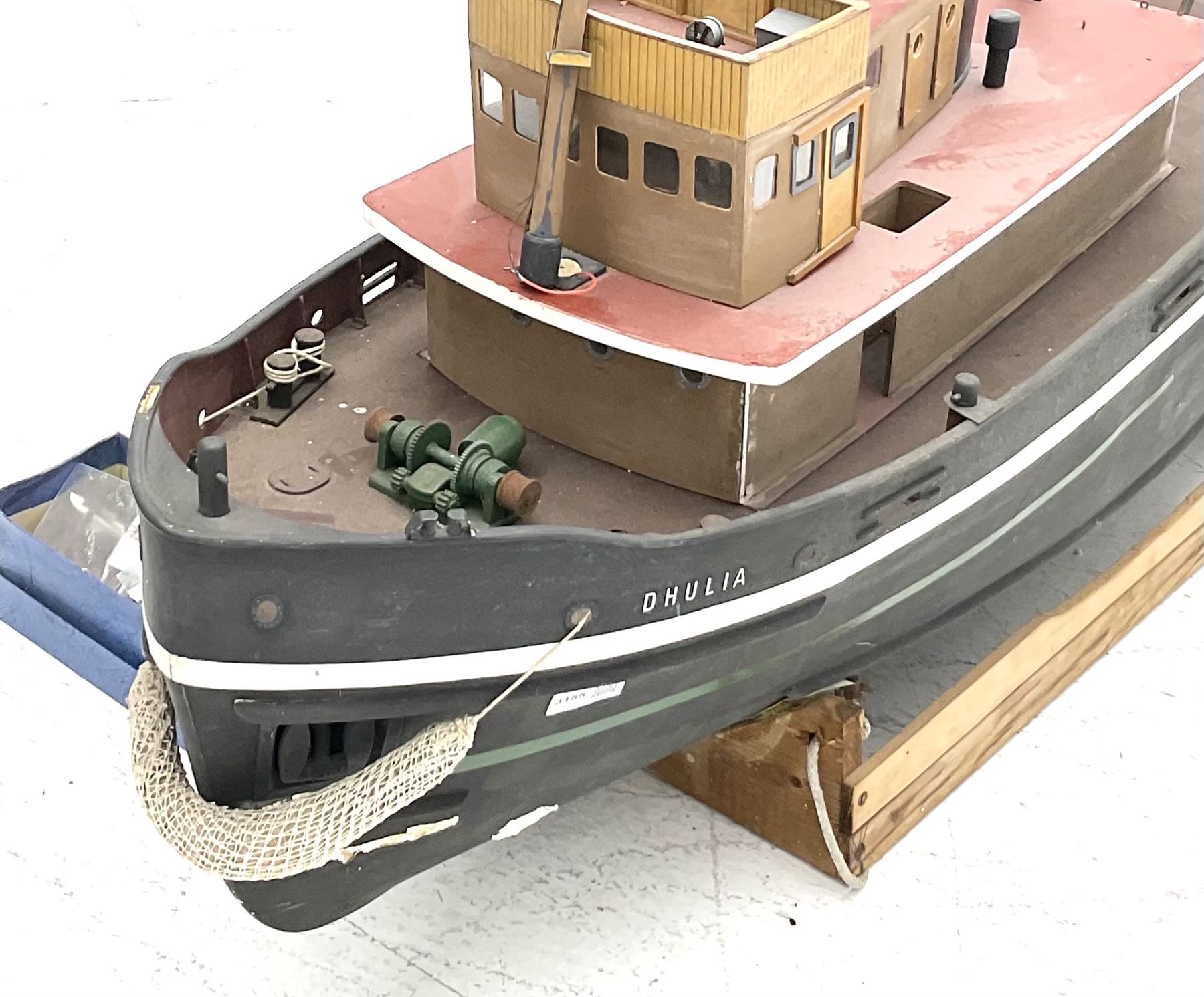 Large model of the tugboat 'Dhulia' on a wooden stand L144cm, together with a box of additional parts and plans
