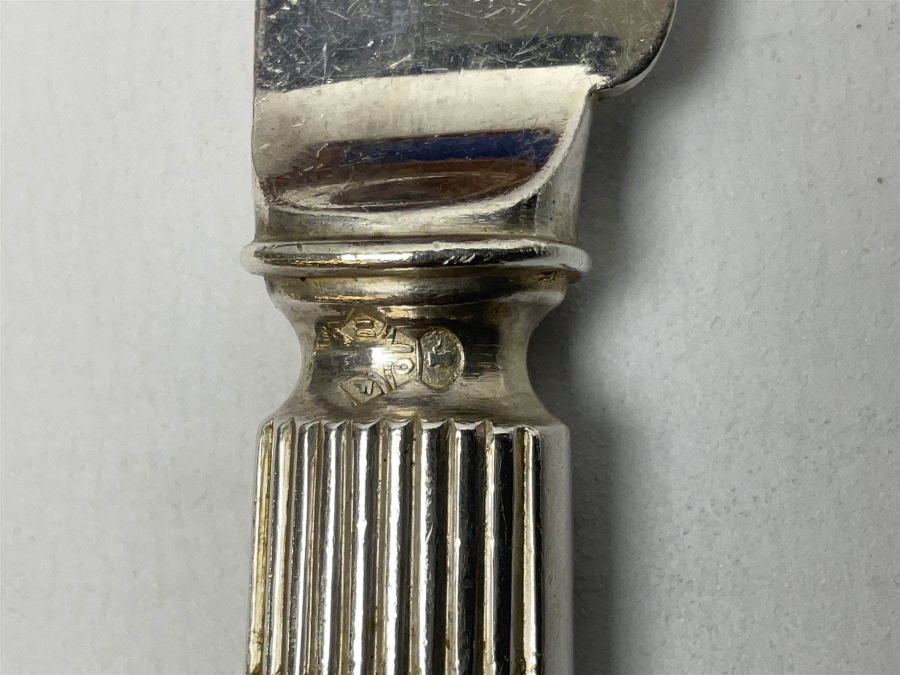 Victorian silver plated dessert set by Elkington & Co for twelve place settings, each reeded handle with vacant cartouche, each with Elkington & Co mark, date letter for 1861, and registration lozenge, contained within a mahogany case with vacant brass cartouche to the hinged cover, opening to reveal a Royal blue baize lined interior with removable tray, case H6cm W29.5cm D26.5cm