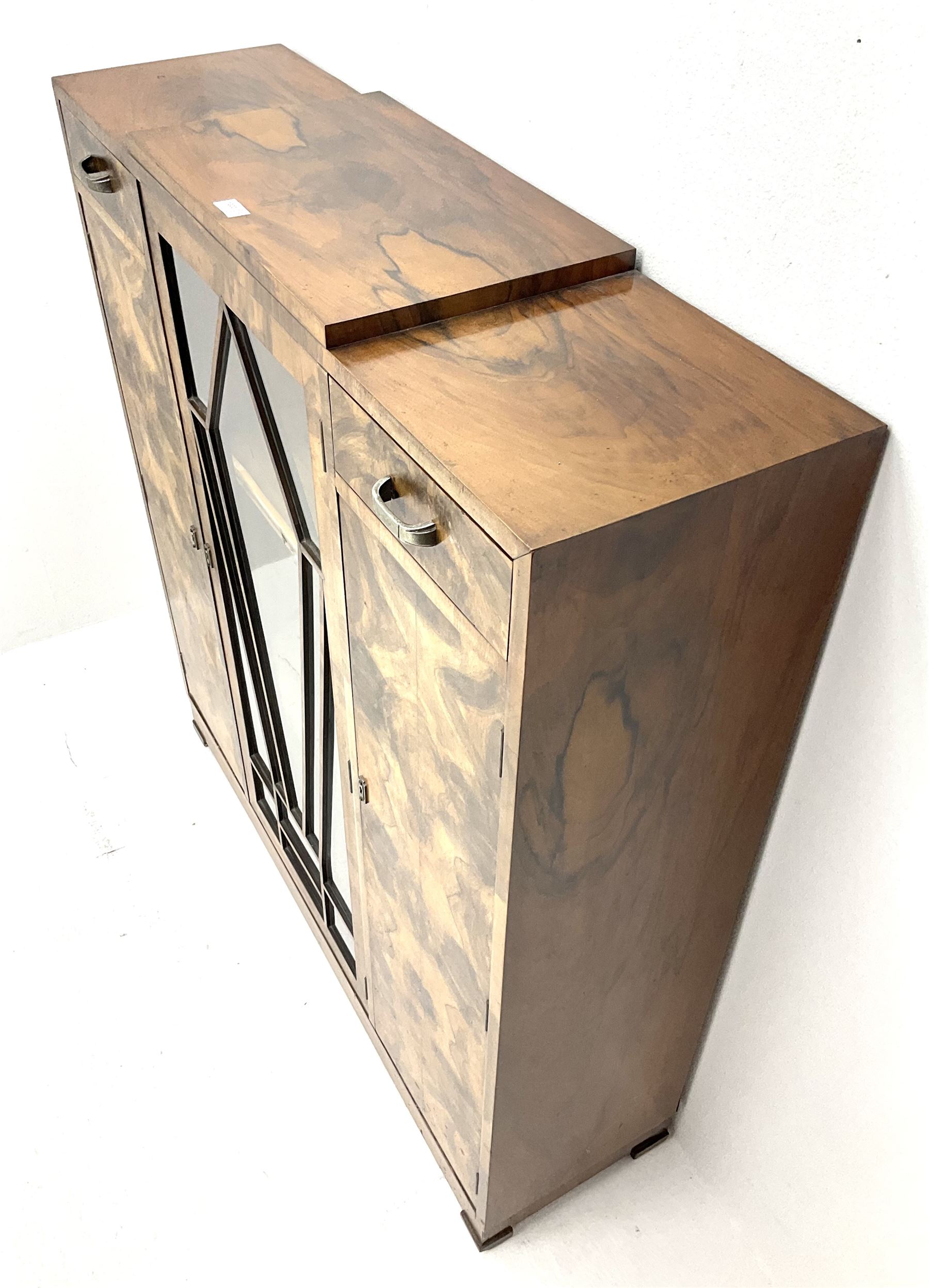 Art Deco walnut display cabinet, central astragal glazed door flanked by two drawers and two cupboards 