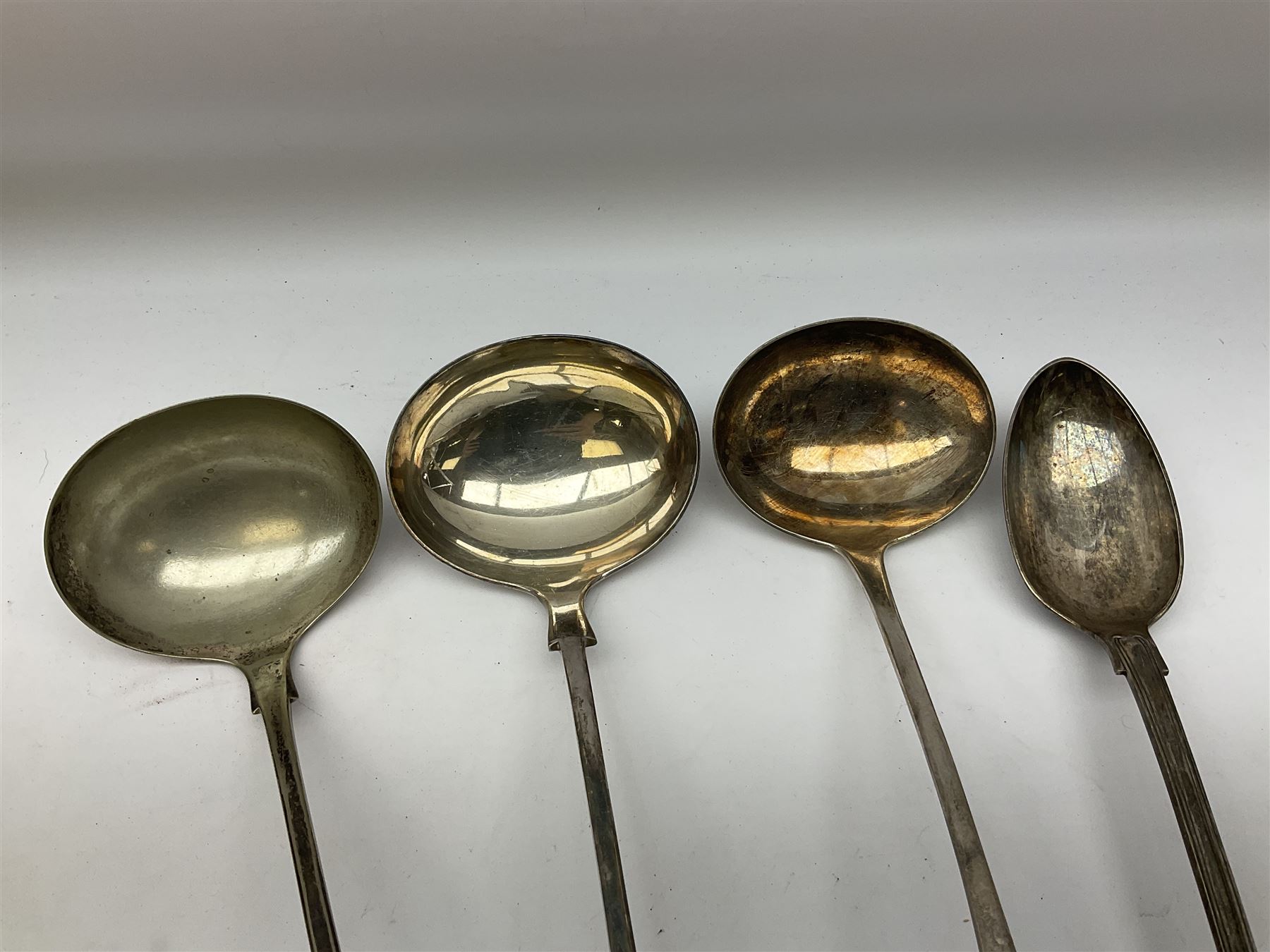 Two silver plated Fiddle pattern soup ladles, a silver plated Old English pattern soup ladle, and a silver plated Kings pattern basting spoon, (4)