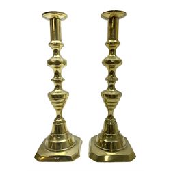 Pair of brass candlesticks, with push rod ejectors, H29cm