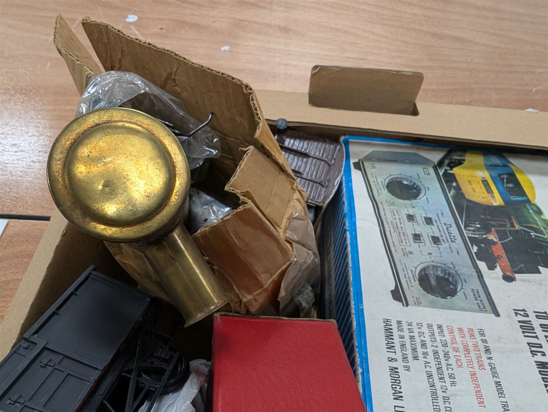 Hornby 'O' gauge 42380 No.2 Turntable, 43063 Points and 42320 No. 1 Level Crossing, all boxed, together with two tin plate passenger coaches, Hornby 'O' gauge LMS tender, three plastic 'O' gauge wagons, Hornby mechanisms, HM Duette Transformer Controller and other accessories