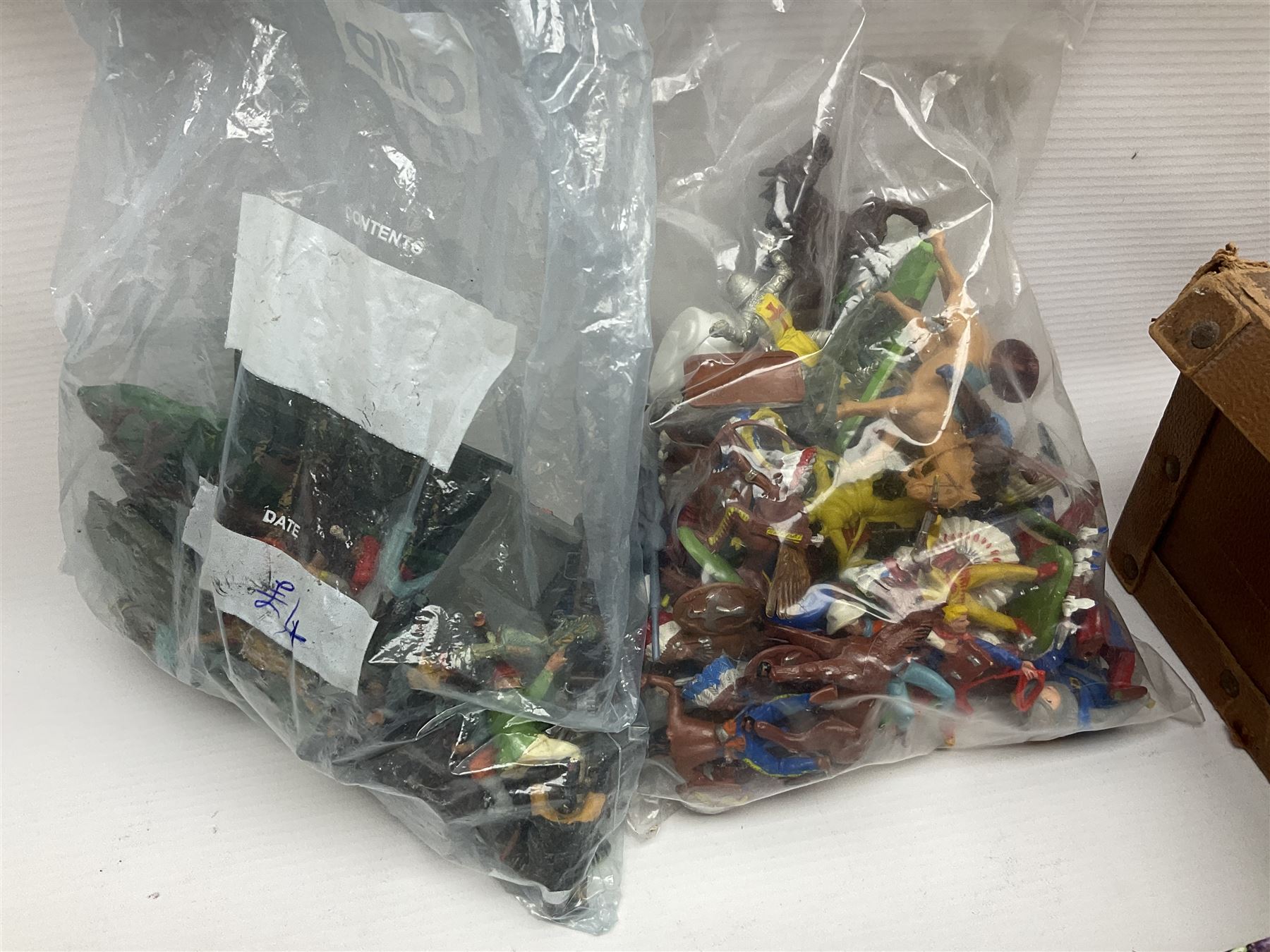 Large variety of predominantly metal miniature soldiers, a mixture of painted and non-painted figures, to include examples of American, British and European soldiers 