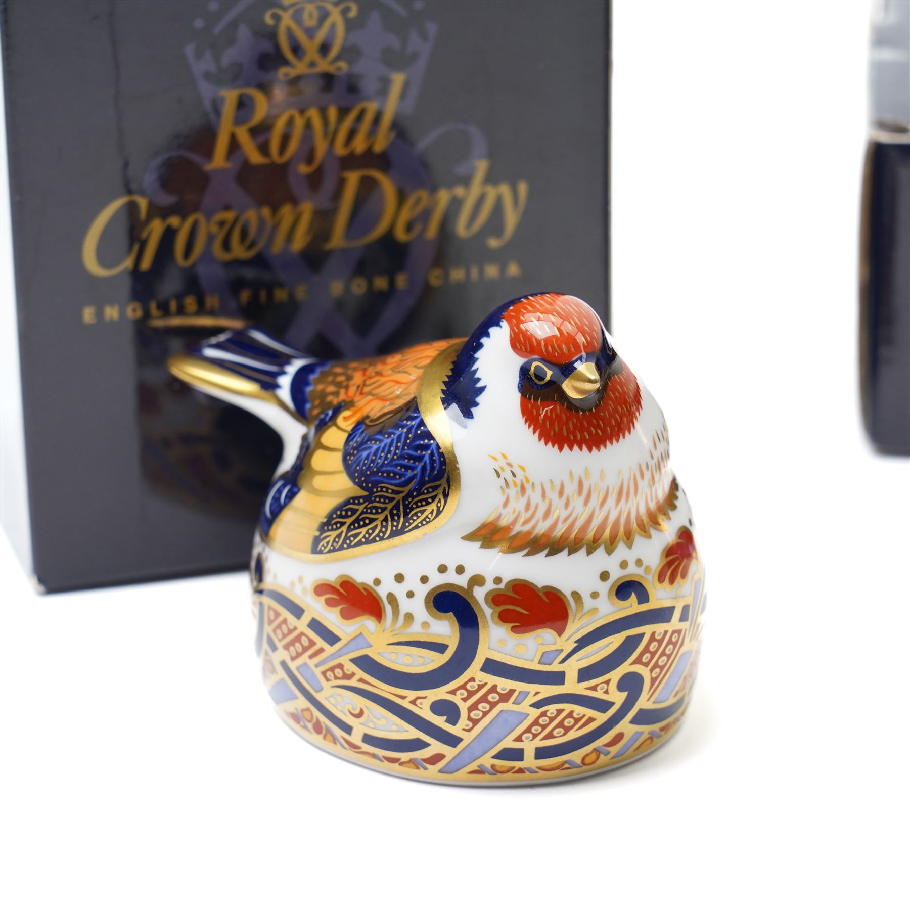 Six Royal Crown Derby paperweights, comprising Robin (unboxed), Robin nesting with gold stopper, Goldfinch nesting with gold stopper, Linnet with gold stopper, Tawny Owl with gold stopper and Crested Tit with gold stopper (6)