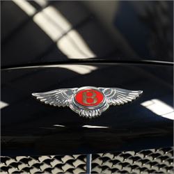2001 Bentley Arnage Red Label Saloon

Registration: BU51 TGX
Engine: 6.75-litre turbocharged V8 petrol
Transmission: Automatic
Odometer reading: 39,942 miles
Colour: Black Sapphire metallic
Interior: Magnolia leather with burr walnut veneers
Previous owners: 3
V5C: Present
Service history: Good service records

An exceptional Bentley Arnage Red Label Saloon, finished in Black Sapphire metallic, a very dark blue, with a Magnolia leather interior, contrasting dark blue carpets and extensive burr walnut veneers. The car displays an odometer reading of approximately 39,942 miles.

The Arnage Red Label combined Bentley’s renowned 6.75-litre turbocharged V8 engine with automatic transmission, delivering effortless performance in a traditionally appointed luxury saloon. The model is distinguished by its imposing proportions, characteristic Bentley radiator grille and finely crafted interior.

Presented in excellent condition throughout, the bodywork and metallic paint finish appear particularly well preserved, complemented by clean brightwork and the correct Bentley alloy wheels. The engine bay is also notably well detailed.

The interior presents exceptionally well, retaining its Magnolia leather upholstery, polished burr walnut veneers, original factory instrumentation and switchgear. The leather displays only light creasing consistent with careful use.

The car has had three previous owners and is accompanied by good service records.

Features

• 6.75-litre turbocharged V8 petrol engine
• Automatic transmission
• Black Sapphire metallic paintwork
• Magnolia leather interior
• Contrasting dark blue carpets
• Burr walnut veneers
• Electrically adjustable front seats
• Air conditioning
• Factory instrumentation and switchgear
• Bentley alloy wheels
• Right-hand drive
• Odometer reading of approximately 39,942 miles
• Three previous owners
• Good service records
• V5C present

This vehicle forms part of the Estate of the Late John Sills and is offered for sale by the Executors, confirming a genuine reason for sale.