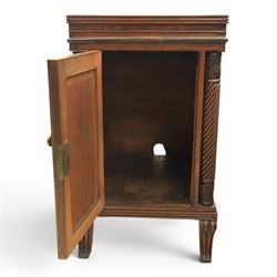  Pair of Regency mahogany bedside cabinets, rectangular top above a central cupboard door with flame mahogany veneer, flanked by spirally turned column uprights, raised on shaped supports