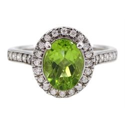 Silver oval peridot and cubic zirconia cluster ring, stamped 925 