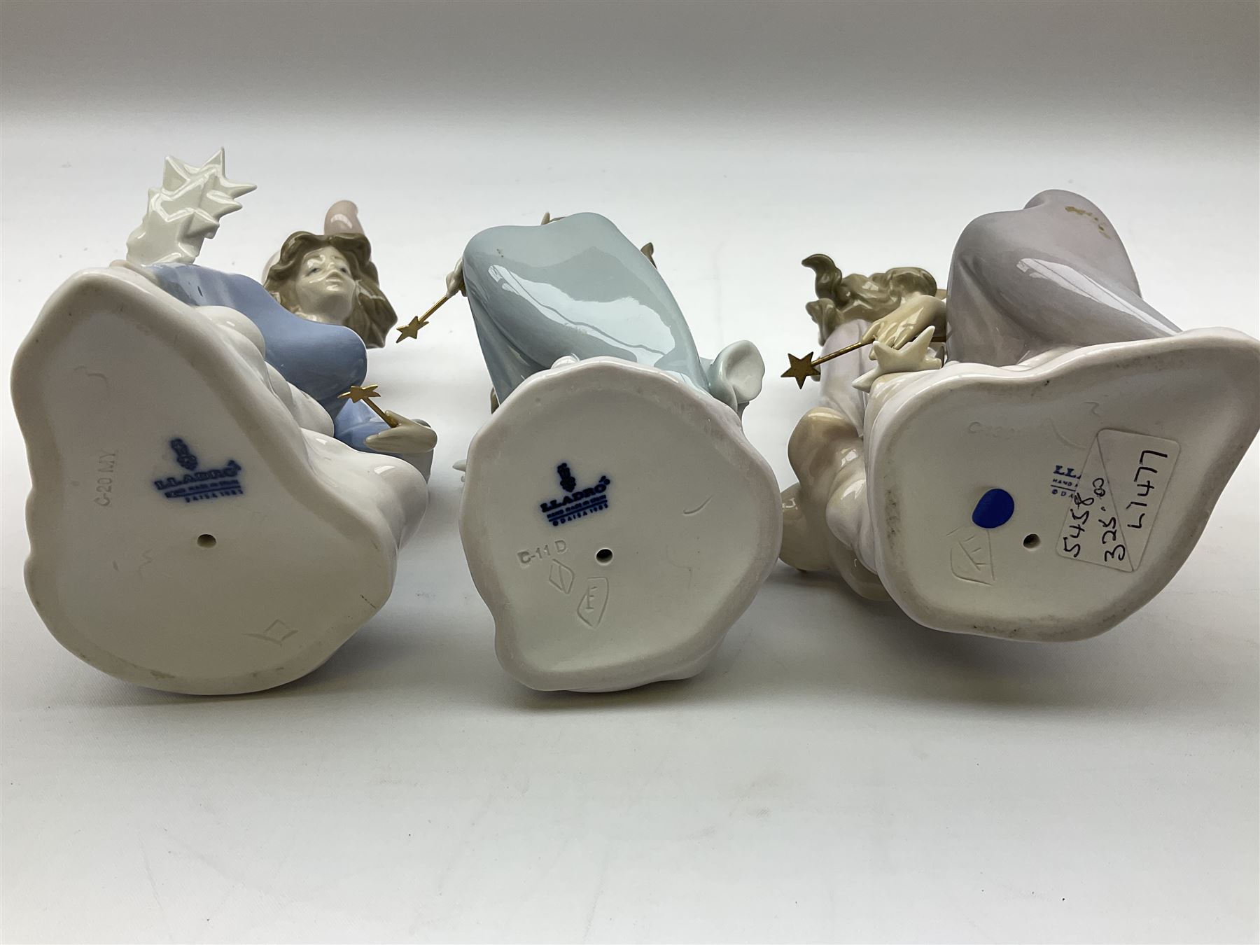Lladro Star Bright Girl set, comprising Wishing on a Star no 1475, Starlight Starbright no 1476 and Stargazing  no 1477, all in original boxes, largest example H19cm
