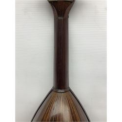 Late 19th century Italian lute back mandolin with segmented bowl back, bears label Gennaro Maglioni Napoli L61cm; in ebonised wooden case; together with another similar damaged Italian lute back mandolin for restoration or spares (2)