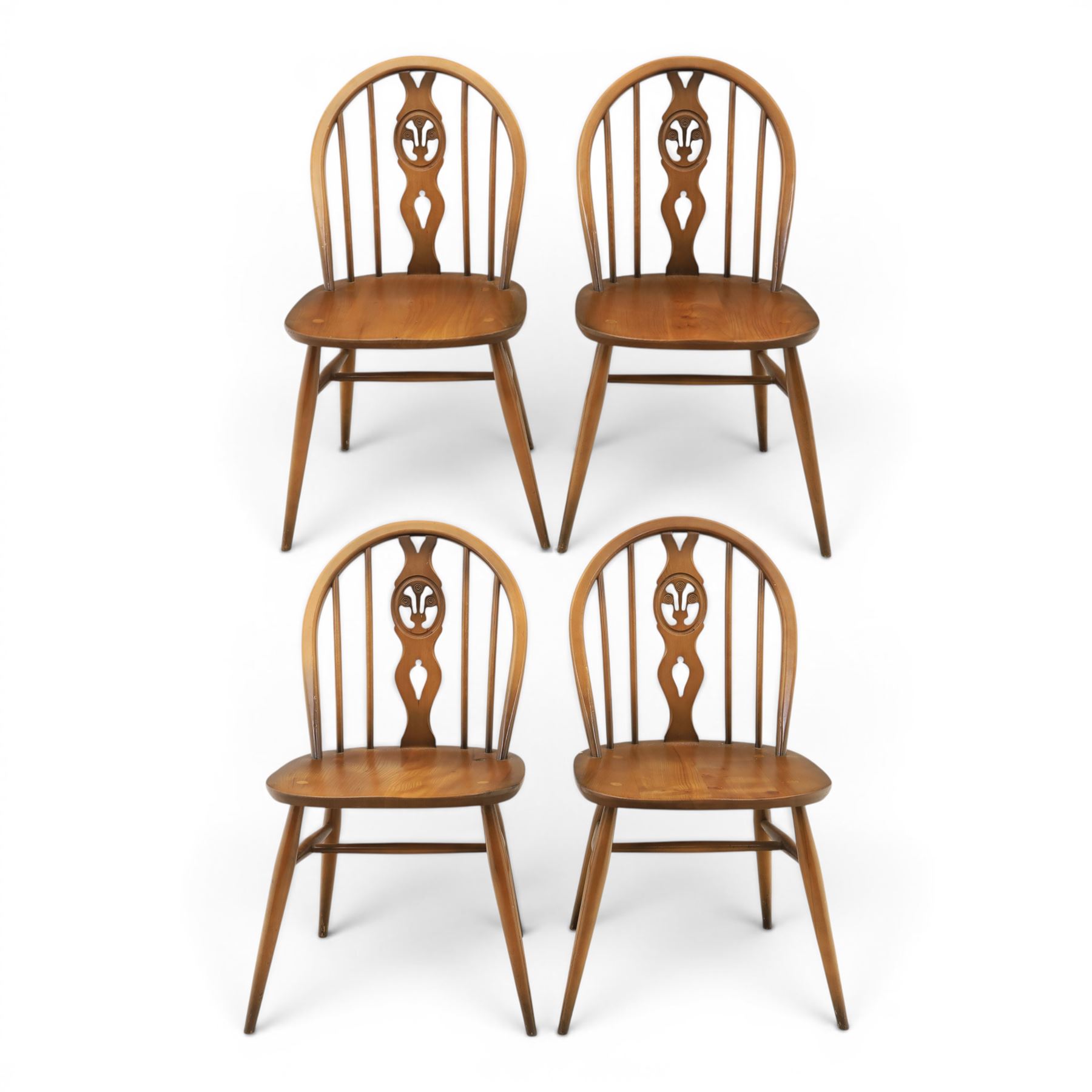 Ercol - Set of four dark elm 'Fleur De Lys' chairs