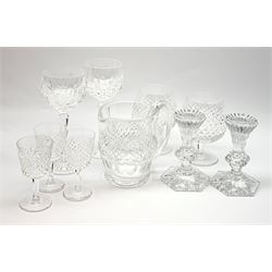 A group of Waterford crystal, comprising a pair of Chatham candlesticks, pair of brandy balloons, pair of hock glasses, three sherry glasses, and jug. (10). 