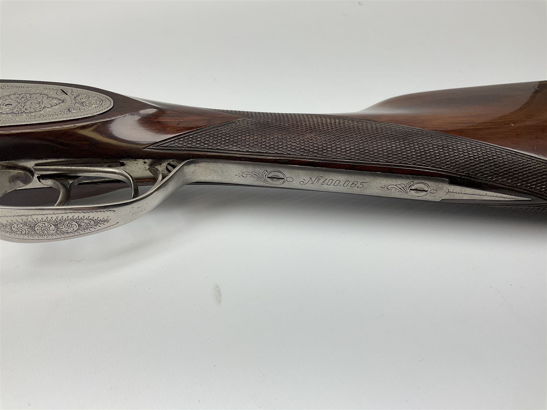Gunmark Silver Sabel De Luxe 12-bore side by side double barrel side lock ejector sporting gun, 68.5cm barrels with 2.75cm chambers and matt bluing, walnut stock with chequered grip and fore-end and thumb safety, serial nos.12509 & 100.085, L111.5cm overall SHOTGUN CERTIFICATE REQUIRED