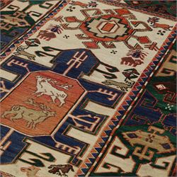 Caucasian Soumak flatweave rug, ivory field with a bold central geometric medallion framed by stylized animal motifs and angular tribal devices, one end of fringe cut, 88x70cm 